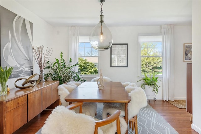 7 Maloney Ln, Middletown, RI 02842 - dining space featuring plenty of natural light, dark wood-type flooring, and baseboards