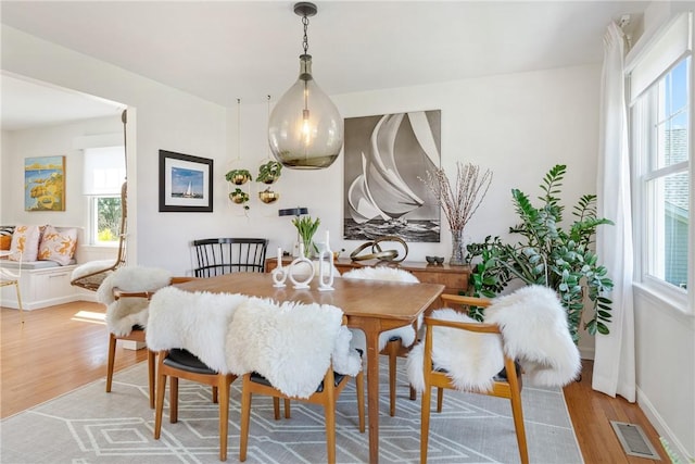 7 Maloney Ln, Middletown, RI 02842 - dining space featuring light wood-style flooring and baseboards
