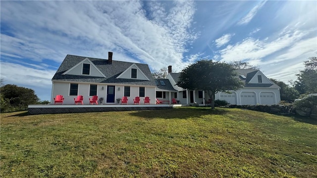 1087 Lakeside Dr, Block Island, RI 02807 - view of front of home with a garage, a front lawn, and a chimney