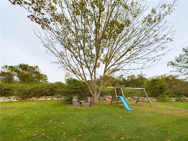 1087 Lakeside Dr, Block Island, RI 02807 - view of green lawn with a playground