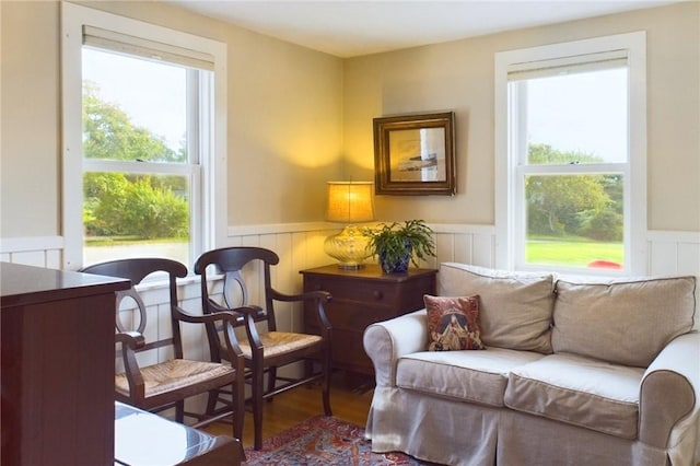 1087 Lakeside Dr, Block Island, RI 02807 - living area featuring wainscoting and wood finished floors