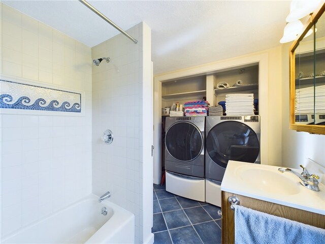1087 Lakeside Dr, Block Island, RI 02807 - full bath featuring washer and clothes dryer, tile patterned flooring, vanity, and shower / tub combination