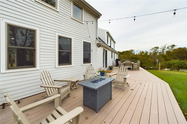 1087 Lakeside Dr, Block Island, RI 02807 - wooden terrace with an outdoor fire pit, outdoor dining area, and a yard