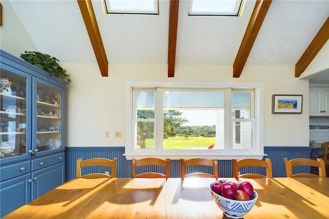 1087 Lakeside Dr, Block Island, RI 02807 - dining area featuring a wainscoted wall