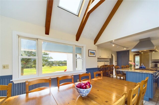 1087 Lakeside Dr, Block Island, RI 02807 - dining space featuring track lighting and wainscoting