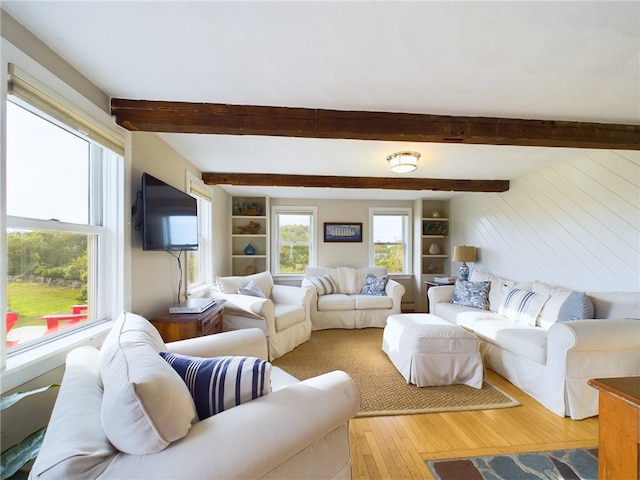 1087 Lakeside Dr, Block Island, RI 02807 - living room featuring hardwood / wood-style flooring, beam ceiling, and built in features