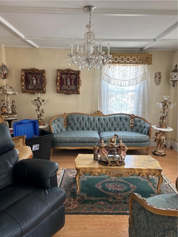 259 Park Ave, Woonsocket, RI 02895 - living area featuring wood finished floors and a chandelier