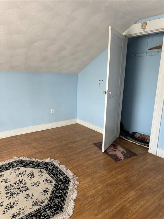 259 Park Ave, Woonsocket, RI 02895 - bonus room featuring lofted ceiling, baseboards, and wood finished floors