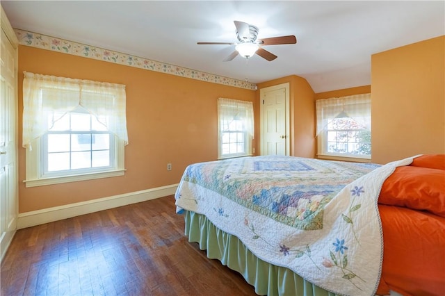 369 Vine St, Pawtucket, RI 02861 - bedroom with baseboards, multiple windows, dark wood-type flooring, and ceiling fan