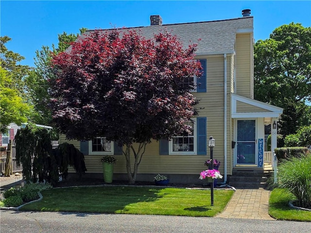369 Vine St, Pawtucket, RI 02861 - view of front of home featuring a front yard and a chimney
