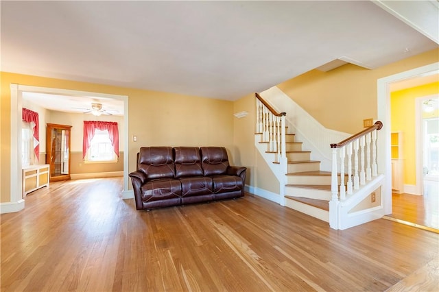 369 Vine St, Pawtucket, RI 02861 - living area featuring wood finished floors, baseboards, stairs, and ceiling fan