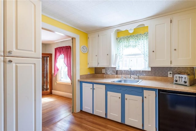 369 Vine St, Pawtucket, RI 02861 - kitchen with dishwasher, a sink, light wood finished floors, and white cabinets