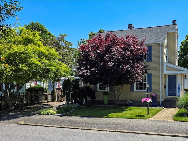 369 Vine St, Pawtucket, RI 02861 - obstructed view of property featuring a chimney