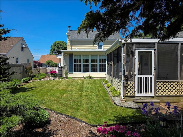 369 Vine St, Pawtucket, RI 02861 - back of property featuring a sunroom and roof with shingles