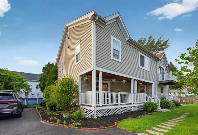 69 Arnold St, Lincoln, RI 02865 - view of front facade featuring covered porch