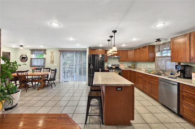 69 Arnold St, Lincoln, RI 02865 - kitchen featuring appliances with stainless steel finishes, a sink, a kitchen island, recessed lighting, and under cabinet range hood