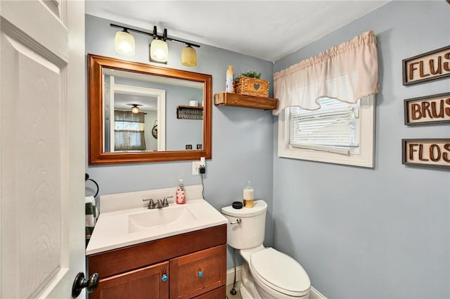 69 Arnold St, Lincoln, RI 02865 - bathroom featuring toilet, vanity, and baseboards