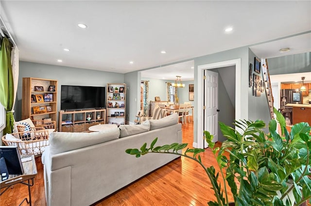 69 Arnold St, Lincoln, RI 02865 - living room featuring wood finished floors, recessed lighting, and a chandelier