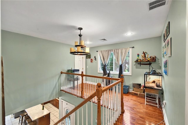 69 Arnold St, Lincoln, RI 02865 - hall with an upstairs landing, recessed lighting, light wood finished floors, and baseboards