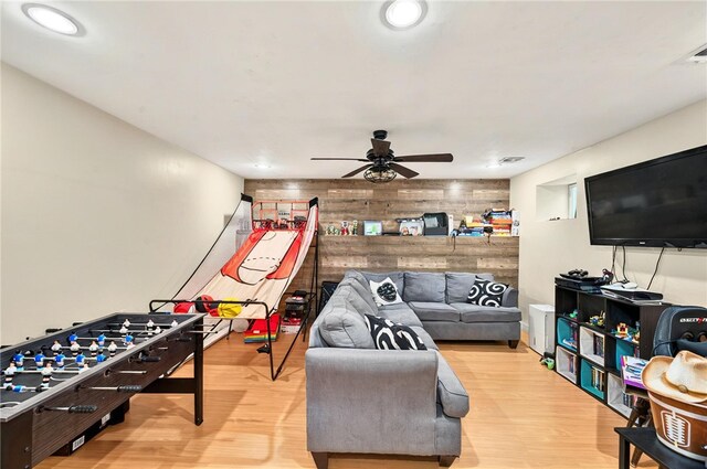 69 Arnold St, Lincoln, RI 02865 - game room featuring a ceiling fan, wood walls, wood finished floors, an accent wall, and recessed lighting