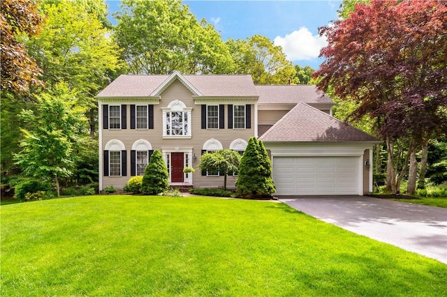 110 Fieldstone Ln, North Kingstown, RI 02874 - colonial house with an attached garage, a front yard, concrete driveway, and a shingled roof