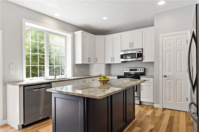 110 Fieldstone Ln, North Kingstown, RI 02874 - kitchen featuring appliances with stainless steel finishes, a sink, white cabinetry, and recessed lighting