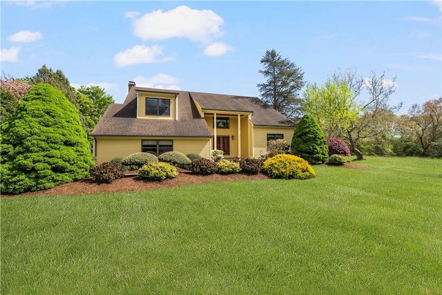 831 N Quidnessett Rd, North Kingstown, RI 02852 - view of front of house with a front lawn and a chimney