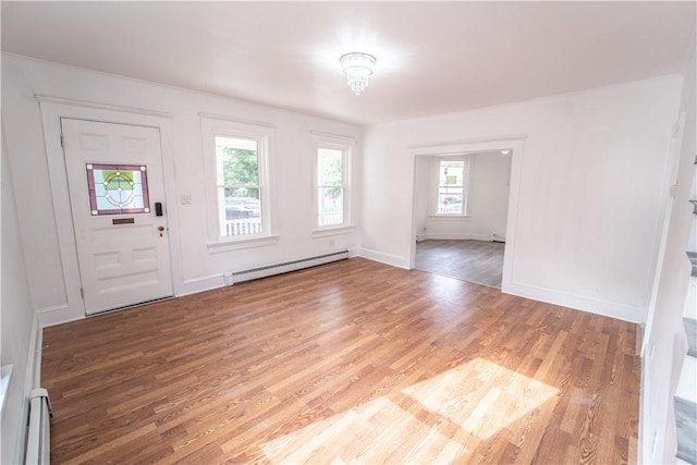 132 Chestnut St, Woonsocket, RI 02895 - entrance foyer with a baseboard heating unit, a baseboard radiator, light wood-style floors, and baseboards
