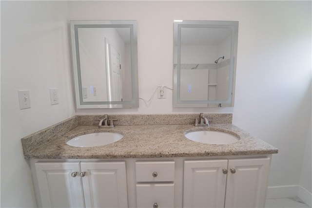 132 Chestnut St, Woonsocket, RI 02895 - full bathroom with double vanity and baseboards