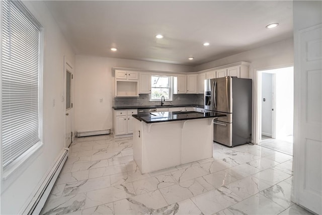 132 Chestnut St, Woonsocket, RI 02895 - kitchen with stainless steel appliances, a baseboard heating unit, a sink, a center island, and recessed lighting