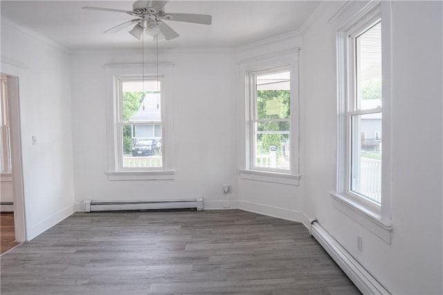 132 Chestnut St, Woonsocket, RI 02895 - unfurnished room with a baseboard heating unit, plenty of natural light, wood finished floors, and ornamental molding