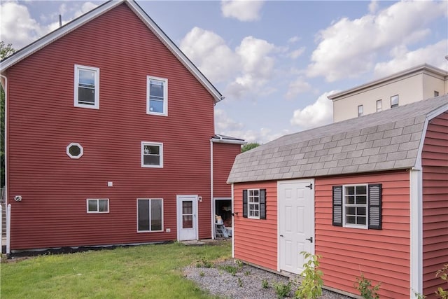 132 Chestnut St, Woonsocket, RI 02895 - rear view of house with a yard and an outdoor structure