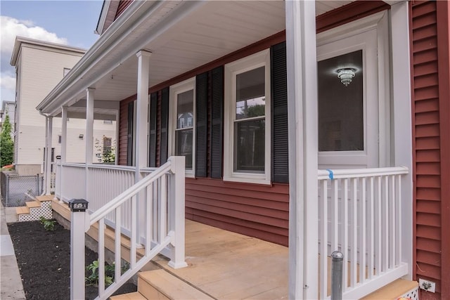 132 Chestnut St, Woonsocket, RI 02895 - doorway to property with covered porch