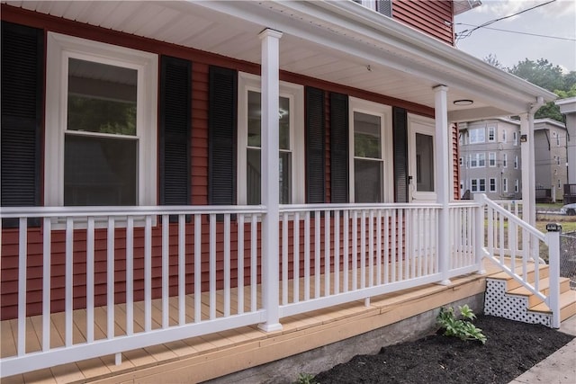 132 Chestnut St, Woonsocket, RI 02895 - view of side of home featuring covered porch