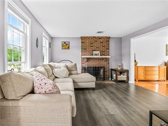 60 Broad St, Plainville, MA 02762 - living room with wood finished floors and a fireplace