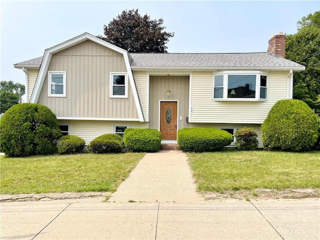 154 Aylsworth Ave, Woonsocket, RI 02895 - bi-level home featuring a front yard, a chimney, a shingled roof, and a gambrel roof