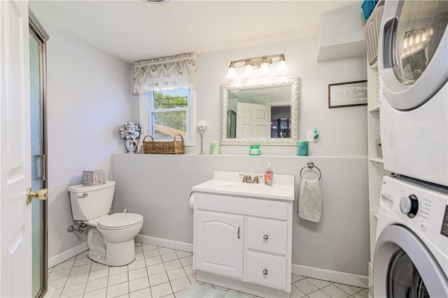 7 Lydia Ave, North Providence, RI 02904 - bathroom with stacked washer / dryer, vanity, toilet, tile patterned flooring, and baseboards