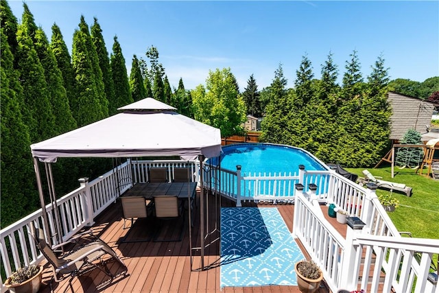 7 Lydia Ave, North Providence, RI 02904 - outdoor pool with a gazebo, a deck, outdoor dining area, and a lawn