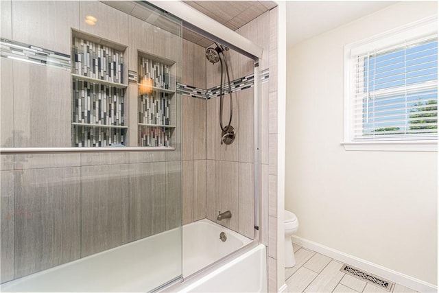 7 Lydia Ave, North Providence, RI 02904 - full bath with toilet, shower / bath combination with glass door, and baseboards