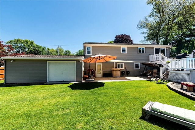 7 Lydia Ave, North Providence, RI 02904 - rear view of property featuring an outdoor structure, a deck, a patio area, and a detached garage