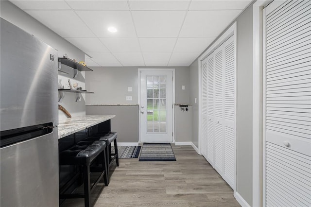 48 Nottingham Dr, Scituate, RI 02831 - entryway with light wood-type flooring, baseboards, and a paneled ceiling