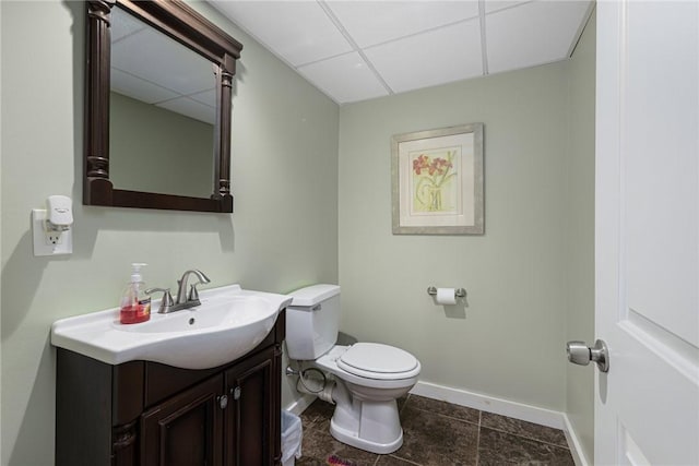 48 Nottingham Dr, Scituate, RI 02831 - bathroom with vanity, toilet, a paneled ceiling, and baseboards