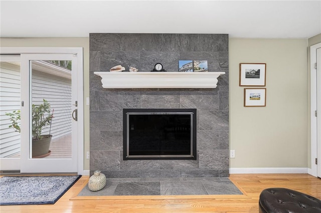 48 Nottingham Dr, Scituate, RI 02831 - detailed view of wood finished floors, baseboards, and a tiled fireplace
