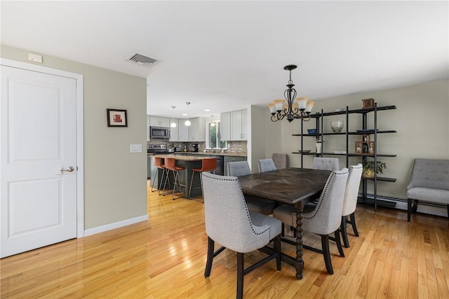 48 Nottingham Dr, Scituate, RI 02831 - dining area with a chandelier, light wood-style flooring, baseboards, and recessed lighting