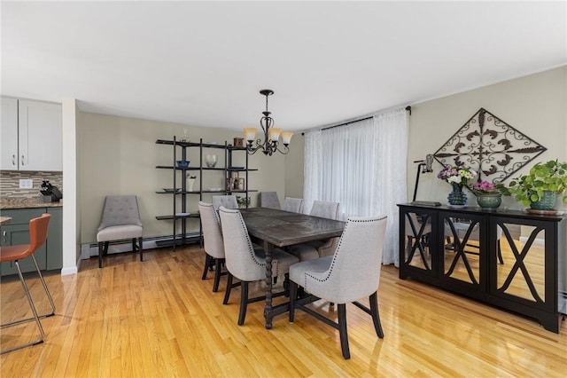 48 Nottingham Dr, Scituate, RI 02831 - dining room featuring a baseboard heating unit, light wood finished floors, and a chandelier