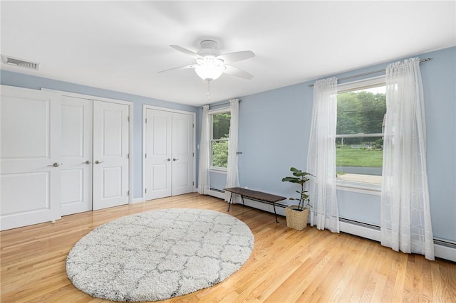48 Nottingham Dr, Scituate, RI 02831 - living area featuring plenty of natural light, a ceiling fan, and light wood-style floors