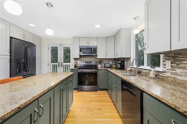 48 Nottingham Dr, Scituate, RI 02831 - kitchen with appliances with stainless steel finishes, a sink, healthy amount of natural light, french doors, and recessed lighting