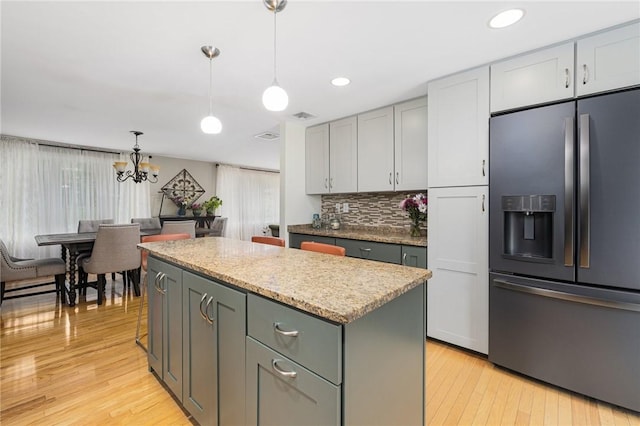 48 Nottingham Dr, Scituate, RI 02831 - kitchen with stainless steel fridge with ice dispenser, a center island, gray cabinetry, light wood-style floors, and recessed lighting