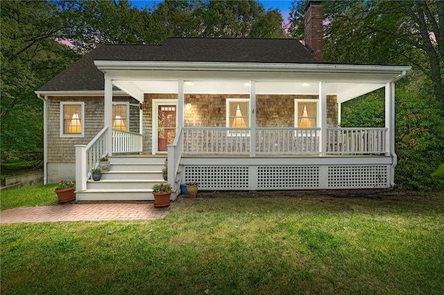 1 Cleo Ct, Westerly, RI 02891 - view of front of home with a chimney, a front lawn, a porch, and roof with shingles