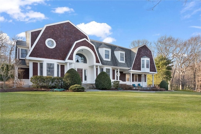 50 Pheasant Dr, East Greenwich, RI 02818 - view of front facade featuring a gambrel roof, a front yard, and roof with shingles